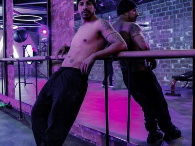 Minimalist training hall with neon violet lighting.